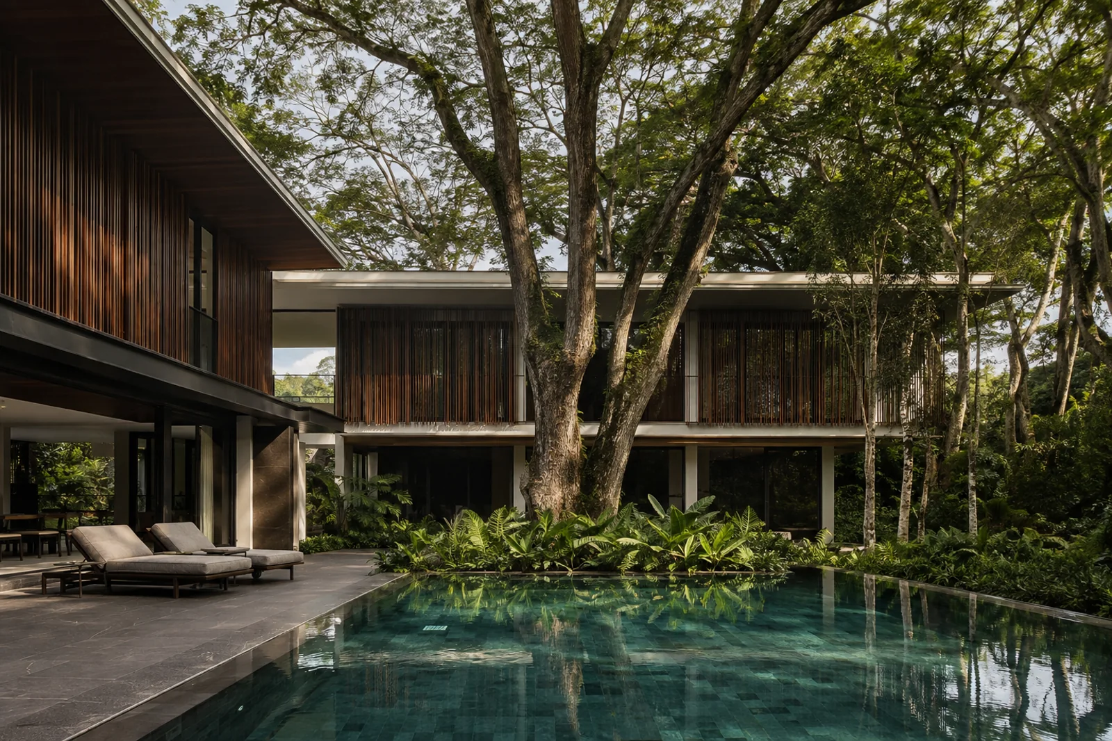 Tropical residence built around mature rain trees and a reflective pool